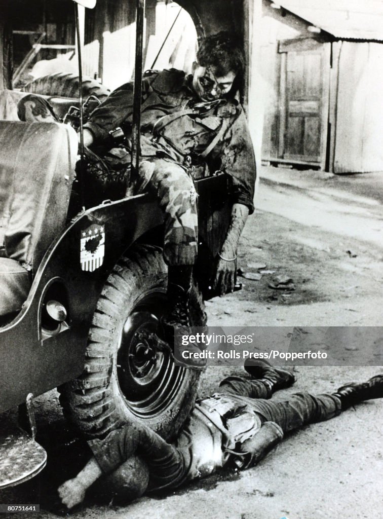 War and Conflict The Vietnam War. pic: January 1968. Saigon, South Vietnam. A South Vietnamese major lies dead, slumped in a jeep after being shot in the face by Viet Cong guerillas, his driver dead also dead is pinned under a wheel of the vehicle.