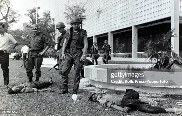 War and Conflict, The Vietnam War, pic: February 1968, Saigon, South Vietnam, American Military Police seen with the bodies of Viet Cong guerillas,...