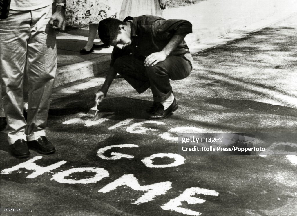 Education Segregation, USA. pic: September 1957. Winston-Salem, North Carolina. Racial abuse spread by whites is about to be removed, after angry whites had voiced their hatred after a black student had been allowed to study at R.J.Reynolds High School.