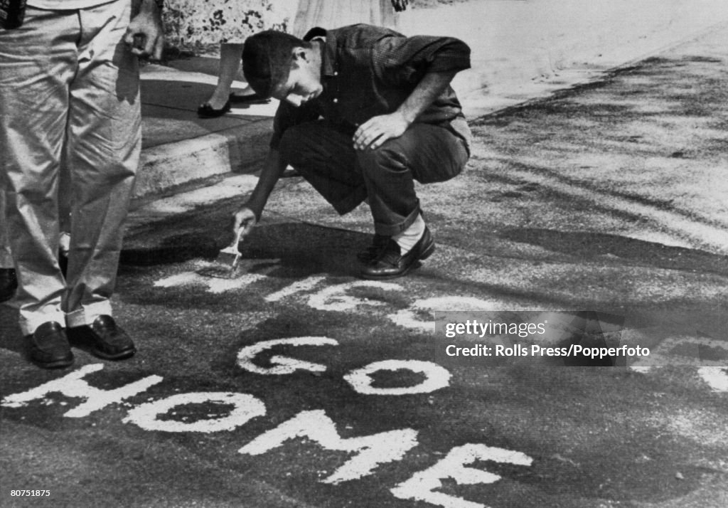 Education Segregation, USA. pic: September 1957. Winston-Salem, North Carolina. Racial abuse spread by whites is about to be removed, after angry whites had voiced their hatred after a black student had been allowed to study at R.J.Reynolds High School.