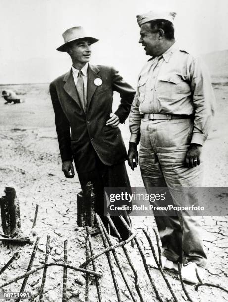 Robert Oppenheimer, left, and Brigadier General Leslie Groves inspect the remains of the test tower at the site of the Trinity atomic bomb test at...