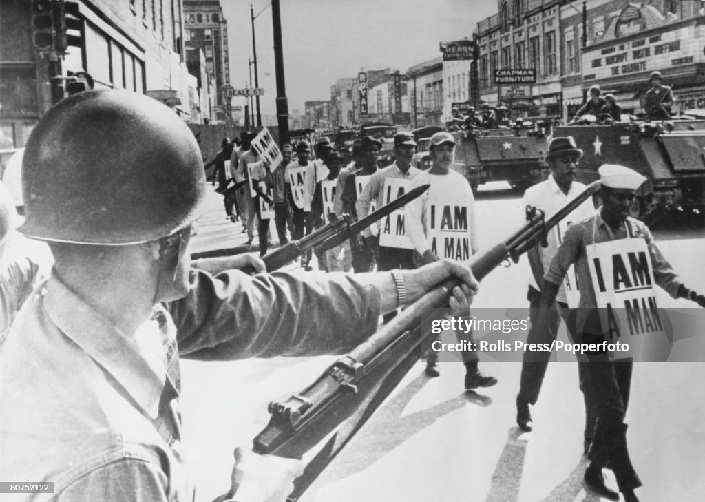 Civil Rights U.S.A. pic: 30th March 1968. Memphis, Tennessee. Guardsmen with fixed bayonets in Beale Street, Memphis as black marchers stage a protest march.