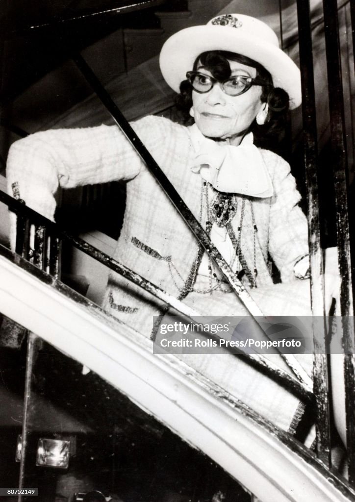 31st January 1969 A portrait French designer Coco Chanel who was the proprietress of the famous dressmaking firm as she is seated on a staircase.
