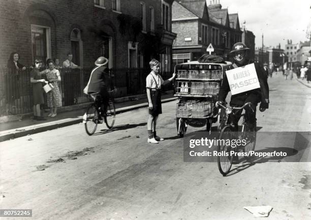 War and Conflict, World War Two, pic: September 1939, Great Britain,A steel helmeted policeman riding his bicycle through the streets with his board...