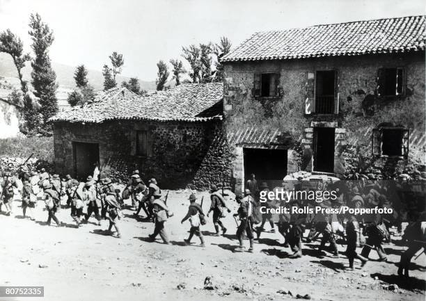War and Conflict, Spanish Civil War , pic: 25th August 1937,A Nationalist force from General Franco's army marching through a village as approach...