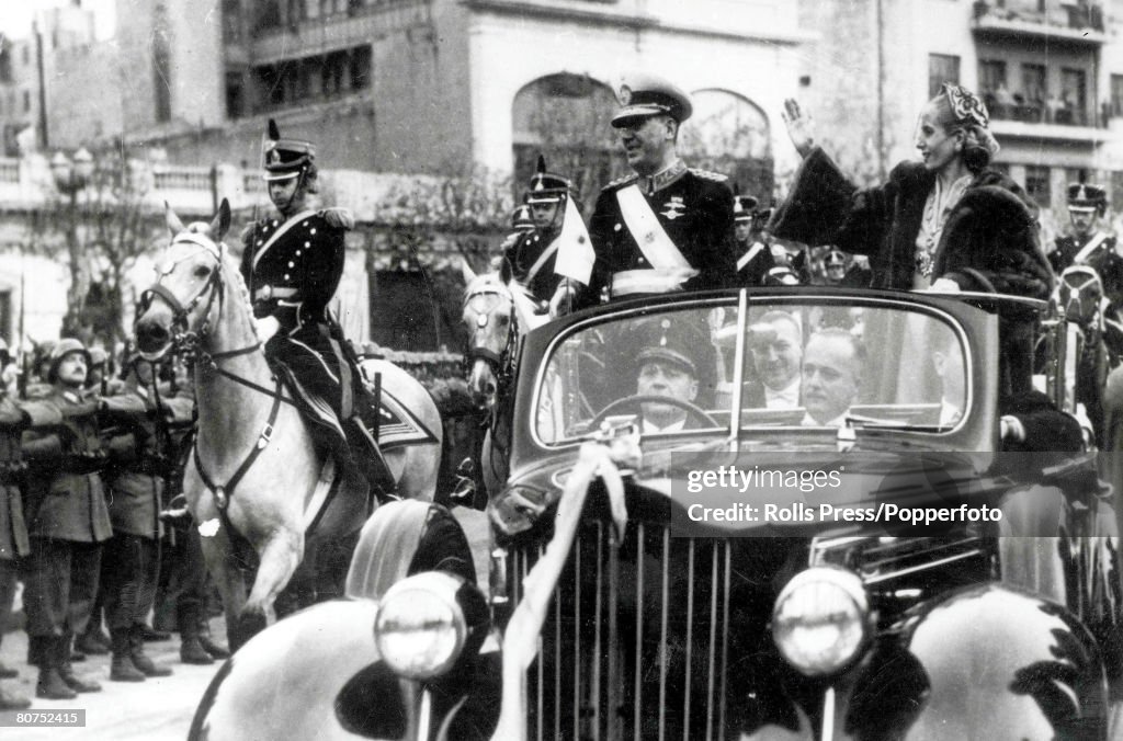 12th June 1952 Argentina President Juan Peron and his wife Eva Peron wave as they ride down the Avenida de Mayo in Buenos Aires after the inauguration as President for another 6 year term.