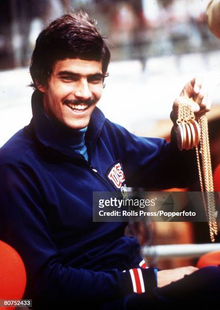 American swimmer Mark Spitz of the United States team holds five of his gold medals won in swimming events at the 1972 Summer Olympics in Munich,...