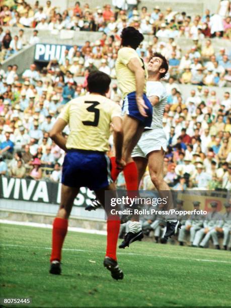 World Cup Finals, Guadalajara, Mexico, 6th June Romania 2 v Czechoslovakia 1, A Czechoslovakian player jumps for the ball with Romanian defender...