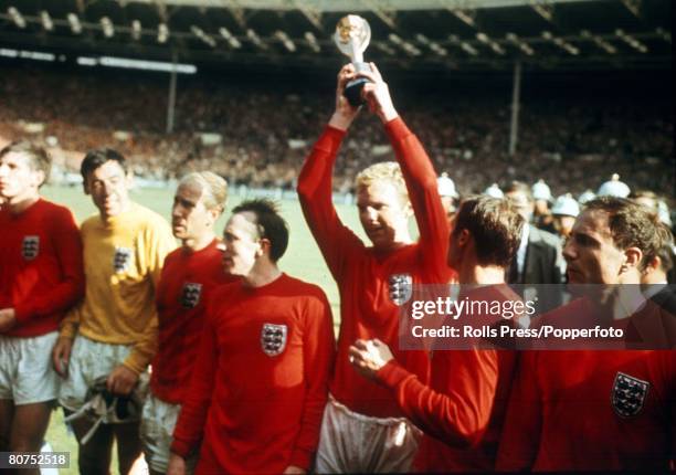 World Cup Final Wembley, England, 30th July, 1966 England 4 v West Germany 2, England's captain Bobby Moore holds aloft the Jules Rimet World Cup...