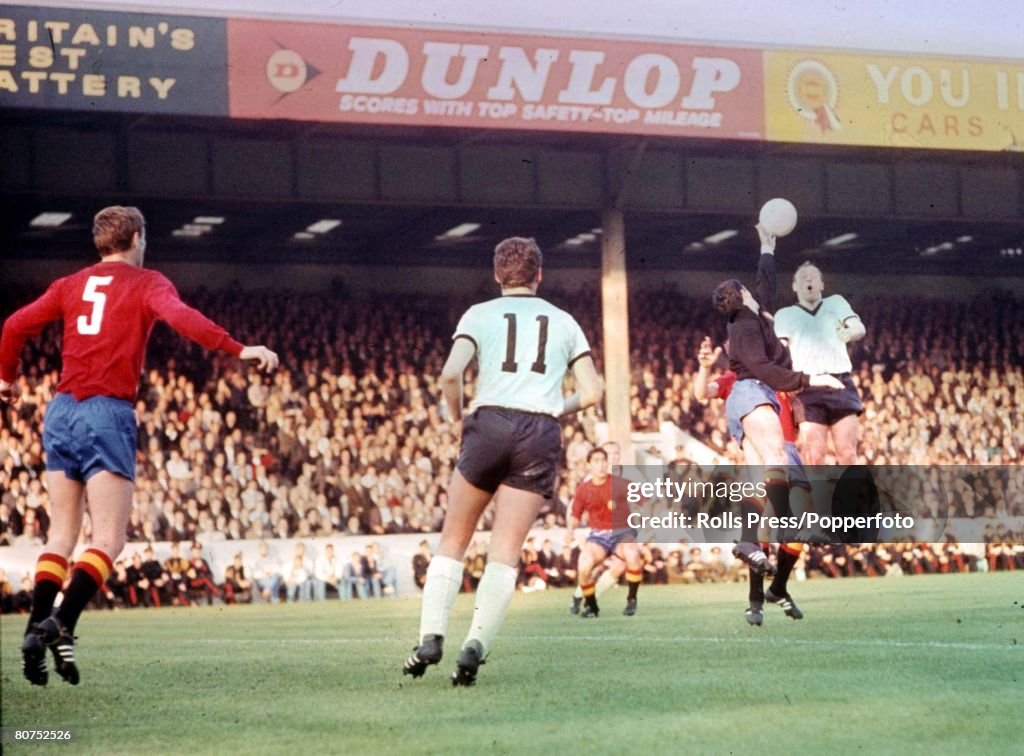 World Cup Finals, 1966 Birmingham, England. 20th July, 1966. West Germany 2 v Spain 1. Spanish goalkeeper Iribar jumps for the ball with West german forward Uwe Seeler as Zoco of Spain (L) and Emerich of Germany (11) look on during their Group Two match.