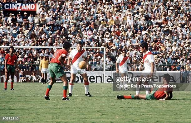 World Cup Finals, Leon, Mexico, 6th June Peru 3 v Morocco 0, Peruvian player Ramon Mifflin is challenged for the ball by Morocco's Driss Banouss...