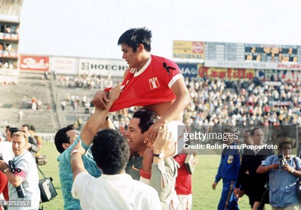 World Cup Finals, Leon, Mexico, 2nd June Peru 3 v Bulgaria 2, A Peruvian player is carried off the pitch by enthusiastic fans at the end of their...