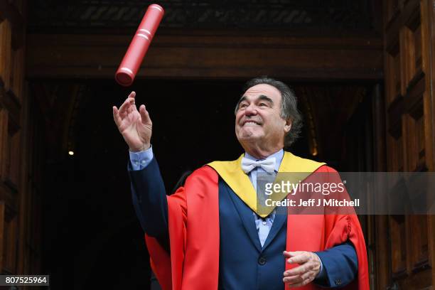 Academy award winning film director Oliver Stone, poses following receiving an honorary degree from the University of Edinburgh on July 4, 2017 in...