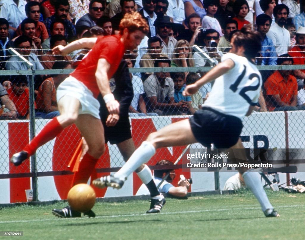 World Cup Quarter-Final, 1970 Leon, Mexico. England 2 v West Germany 3. 14th June, 1970. England's Alan Ball battles for the ball with West Germany's Wolfgang Overath during the match.