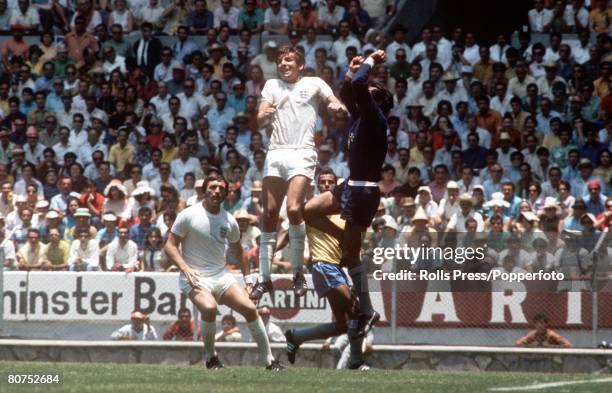 World Cup Finals, Guadalajara, Mexico, 7th June 1970, England 0 v Brazil 1, England forward Martin Peters jumps for the ball with Brazilian...