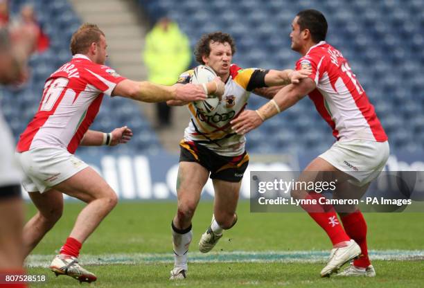 Crusaders RL's Frank Winterstein and Weller Havraki tackle Bradford's Brett Kearney during the Magic Weekend at Murrayfield, Edinburgh.