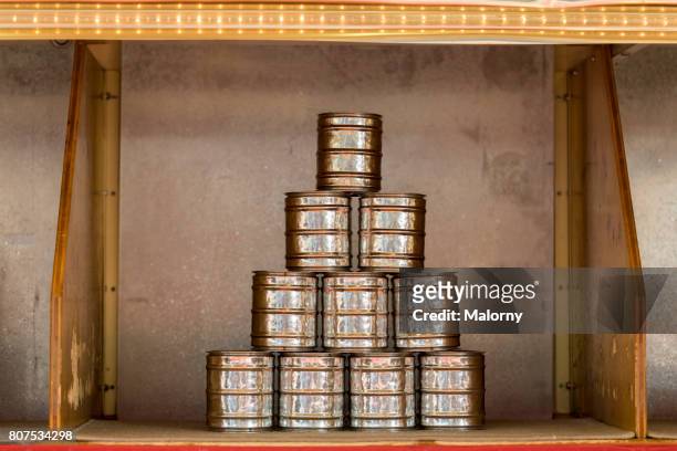 germany, bavaria, munich, pyramid of tin cans in fairground booth at beer fest - padiglione foto e immagini stock