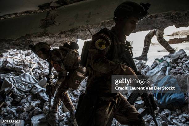 Iraqi commandos advance through ruins of al-Nuri mosque complex on June 29, 2017. The Iraqi Army, Special Operations Forces and Counter-Terrorism...