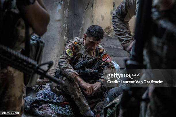 Iraqi forces rest during their operation in al-Nuri mosque complex in Mosul, Iraq on June 29, 2017. The Iraqi Army, Special Operations Forces and...