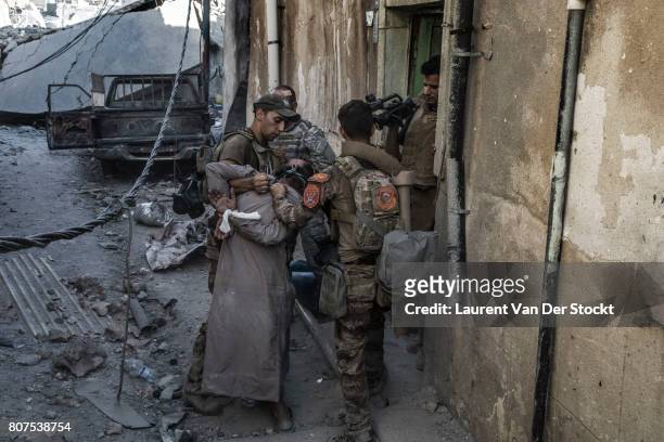 Iraqi soldiers detain a man they found in al-Nuri mosque complex on June 29 in Mosul, Iraq. The Iraqi Army, Special Operations Forces and...