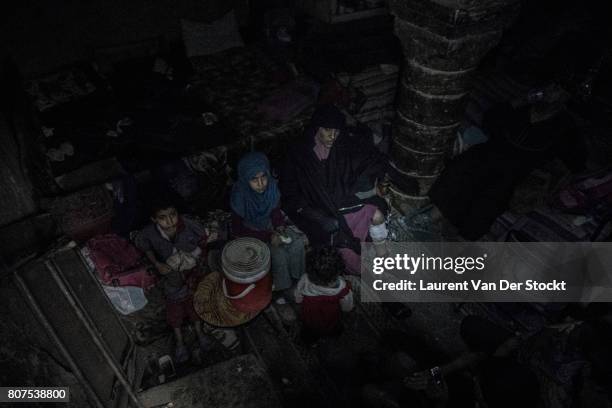 Iraqi soldiers discover a woman and two children in al-Nuri mosque complex on June 29 in Mosul, Iraq. The Iraqi Army, Special Operations Forces and...