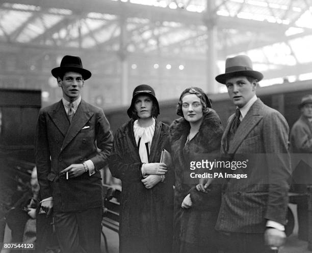 Randolph Churchill, the son of Winston Churchill, right, holding the arm of his sister Diana Churchill, at Waterloo Station before leaving for...