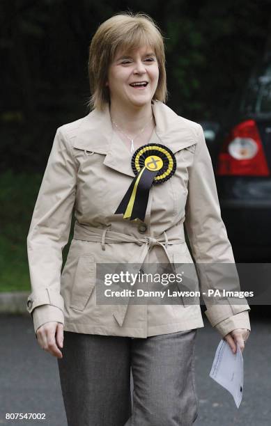 Deputy leader Nicola Sturgeon arrives to cast her vote at Broomhouse Community Hall polling station in Glasgow East.