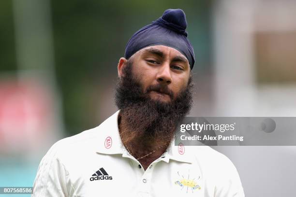 Amar Virdi of Surrey looks on during day two of the Specsavers County Championship Division One match between Surrey and Hampshire at The Kia Oval on...