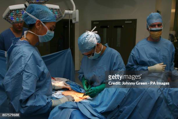Woman, suffering from cancer of the cervix, undergoes a two hour hysterectomy operation at Barts Hospital in central London.