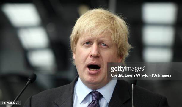 London Mayor Boris Johnson at the Abellio Battersea Bus Depot, London, during the unveiling of the final design for the new jump-on, jump-off...