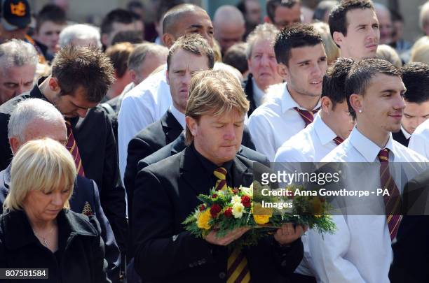 Former Bradford City manager and player Stuart McCall holds a floral tribute in the colours of Bradford City FC during the 25th Anniversary...