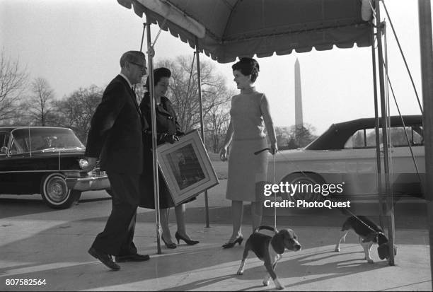 White House usher JB West escorts US First Lady Lady Bird Johnson and her daughter, Luci Baines Johnson, as they move into the White House,...