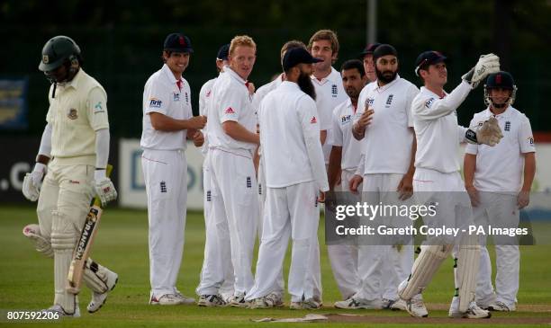 England Lions's Chis Woakes is congratulated by teammates after dismissing Bangladesh's Junaed Siddique during the Tour Match at the County Ground,...