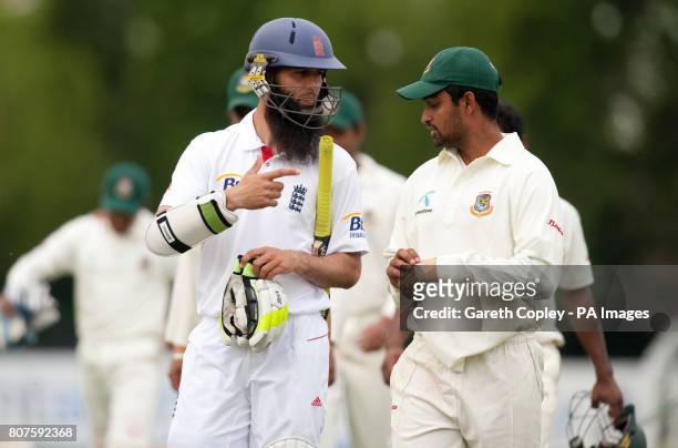 England Lions' Moeen Ali talks with Bangladesh's Tamin Iqbal after winning the match during the Tour Match at the County Ground, Derby.
