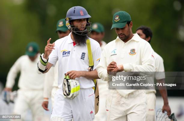 England Lions' Moeen Ali talks with Bangladesh's Tamin Iqbal after winning the match during the Tour Match at the County Ground, Derby.