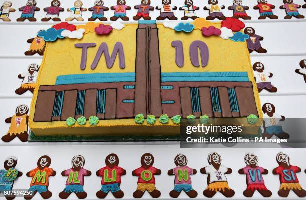 The Tate Modern 10th birthday cake surrounded by gingerbread men at the Tate Modern 10th birthday cake cutting event at the Tate Gallery, London.