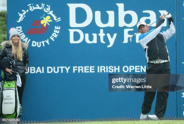 Pablo Larrazabal of Spain watched by his wife Gala Alten during previews ahead of the Dubai Duty Free Irish Open at Portstewart Golf Club on July 4,...