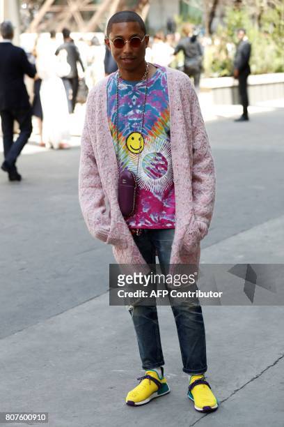 Singer Pharrell Williams poses during the photocall before Chanel 2017-2018 fall/winter Haute Couture collection show in Paris on July 4, 2017. / AFP...