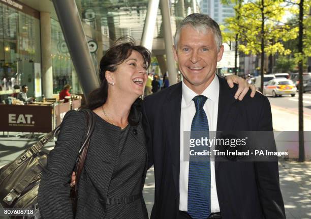 Professor Simon Murch leaves the GMC in London with his wife Alison after he was found not guilty of serious professional misconduct.