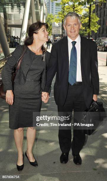 Professor Simon Murch leaves the GMC in London with his wife Alison after he was found not guilty of serious professional misconduct.