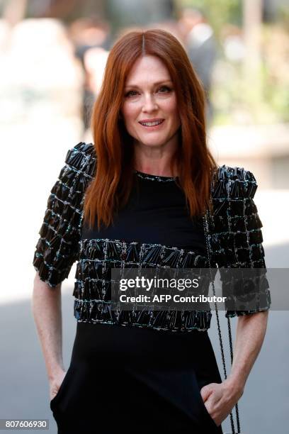 Actress Julianne Moore poses during the photocall before Chanel 2017-2018 fall/winter Haute Couture collection show in Paris on July 4, 2017. / AFP...