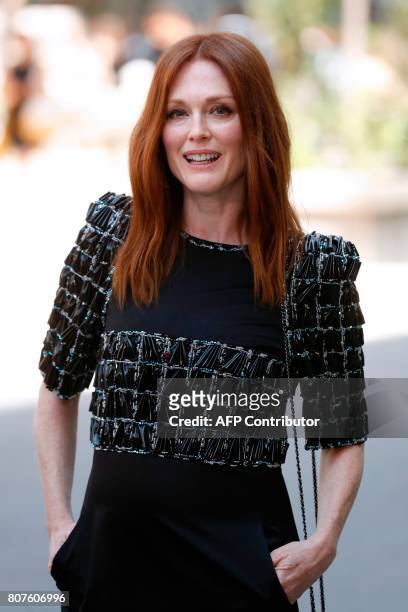 Actress Julianne Moore poses during the photocall before Chanel 2017-2018 fall/winter Haute Couture collection show in Paris on July 4, 2017. / AFP...