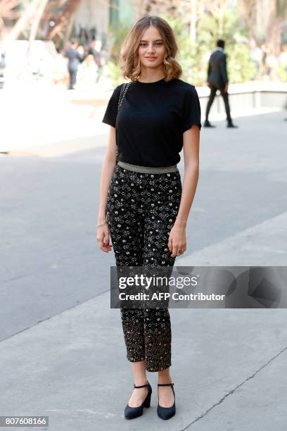 French model and fashion designer Ines de la Fressange's daughter Violette poses during the photocall before Chanel 2017-2018 fall/winter Haute...