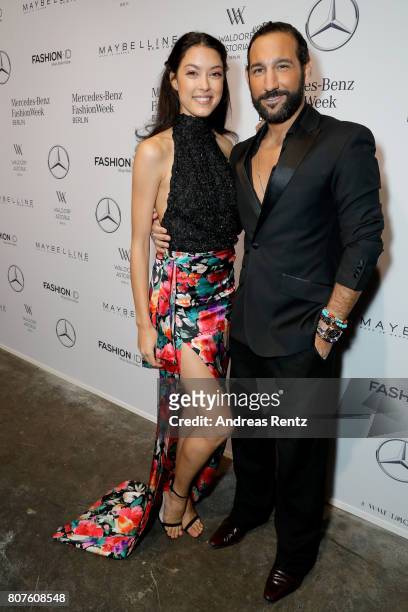 Rebecca Mir and Massimo Sinato attend the Lena Hoschek show during the Mercedes-Benz Fashion Week Berlin Spring/Summer 2018 at Kaufhaus Jandorf on...