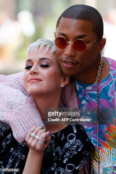 Singer Katy Perry and US singer Pharrell Williams pose during the photocall before Chanel 2017-2018 fall/winter Haute Couture collection show in...