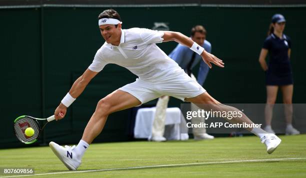 Canada's Milos Raonic returns against Germany's Jan-Lennard Struff during their men's singles first round match on the second day of the 2017...