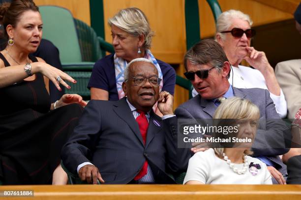 Broadcaster Sir Trevor McDonald looks on from the royal box on centre court on day two of the Wimbledon Lawn Tennis Championships at the All England...