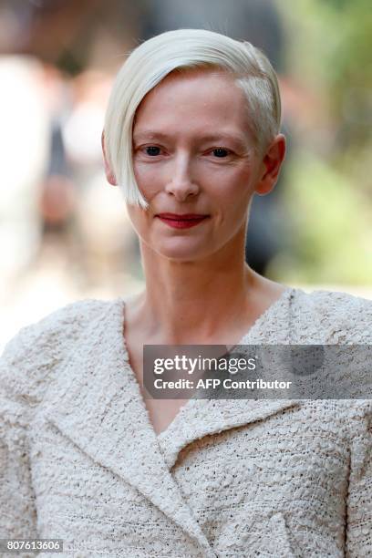 British actress Tilda Swinton poses during the photocall before Chanel 2017-2018 fall/winter Haute Couture collection show in Paris on July 4, 2017....