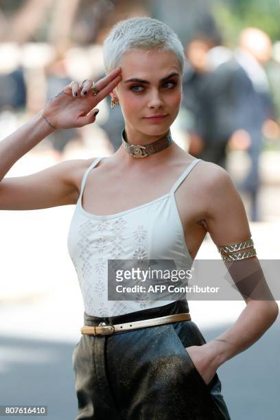 British model and actress Cara Delevingne poses during the photocall before Chanel 2017-2018 fall/winter Haute Couture collection show in Paris on...