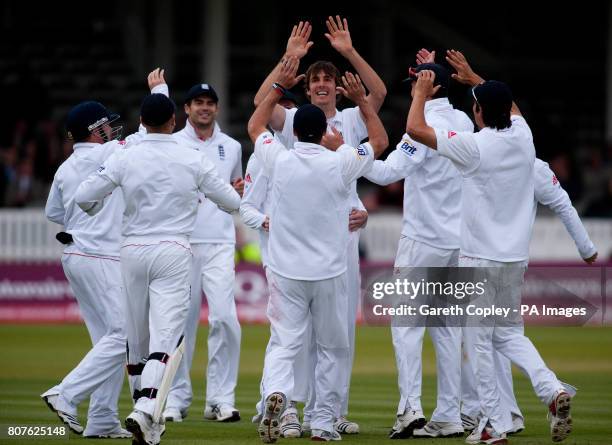 England's Steven Finn celebrates bowling Bangladesh's Mushfiqur Rahim during the first nPower Test Match at Lords, London.